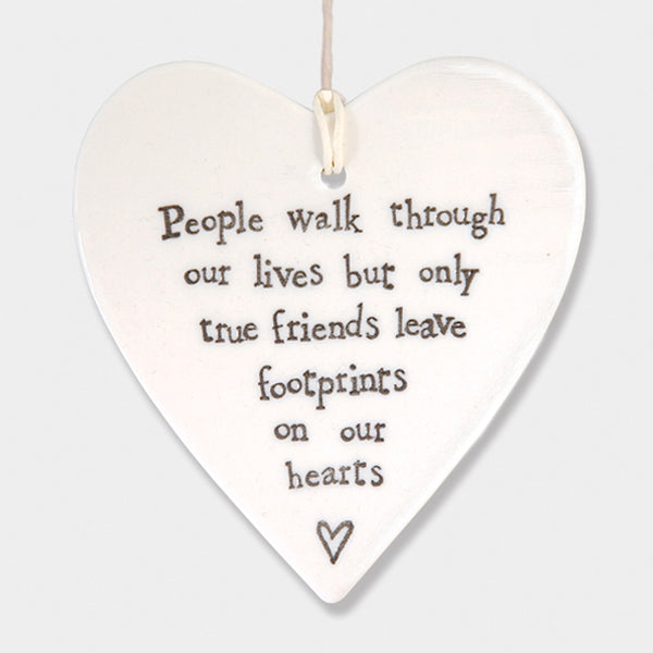 People walk through our lives but only true friends leave footprints on our heart